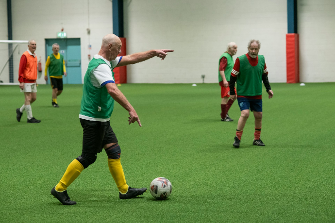 A group of men playing a game of soccer